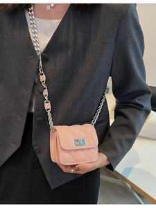 Pink quilted mini chain bag for girls featuring a metal turn-lock and COCO letter strap