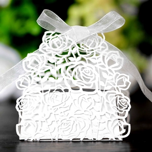 Elegant white laser-cut rose hollow candy box with organza ribbon for wedding decor