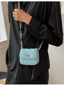 Light blue quilted mini crossbody bag for girls with silver chain and twist lock