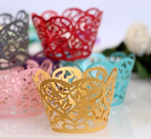 Laser-cut heart lace cupcake wrappers in various colors for wedding and party decoration