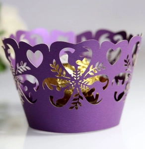 Purple laser-cut cupcake wrapper with pearl paper heart patterns and shiny finish