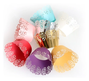 Laser cut crown lace cupcake wrappers in various colors for elegant baking decorations