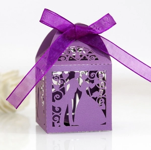 Detailed laser-cut purple wedding favor box with silhouette bride and groom design