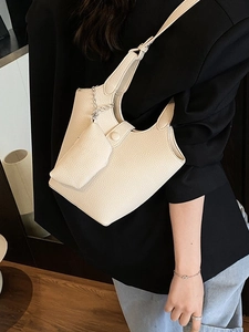 Creamy white litchi leather bucket bag for women with a mini side pouch and silver chain
