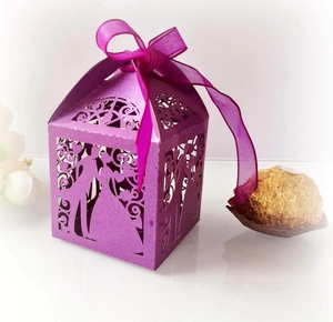 Detailed laser-cut wedding candy box in pearlescent purple with bride and groom silhouettes