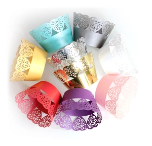 Macro detail of laser-cut heart pattern cupcake wrappers in various vibrant colors