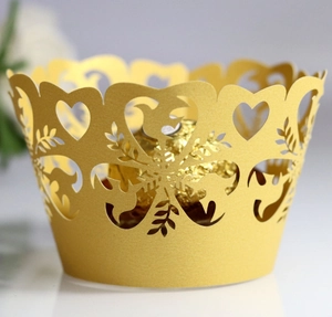 Golden laser-cut cupcake wrapper with heart and bird patterns for elegant dessert decoration