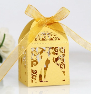 Detailed laser-cut wedding candy box featuring a gold groom and bride silhouette