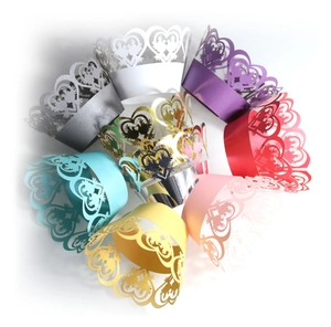 Laser cut heart cupcake wrappers in multiple colors for wedding and party decorations