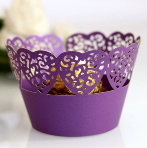 Elegant laser-cut purple cupcake wrapper with heart patterns for wedding cake decoration
