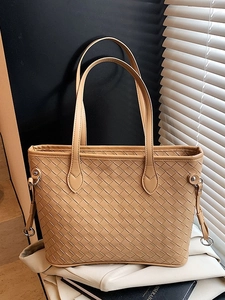 Large woven tote bag in camel brown with crossbody strap and aesthetic lighting