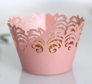 Elegant laser-cut pink lace cupcake wrappers for wedding and party decorations