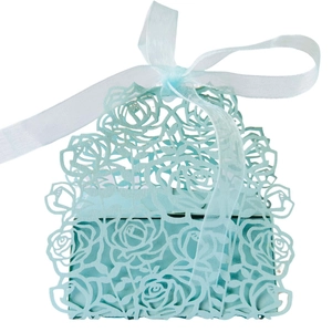 Elegant light blue laser-cut rose gift box with matching silk ribbon for wedding party favors