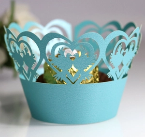 Laser-cut sky blue pearl paper cupcake wrappers with heart and dove wedding pattern
