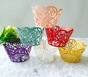 Detailed laser-cut hollow lace cupcake liners in six vibrant colors for cake decoration