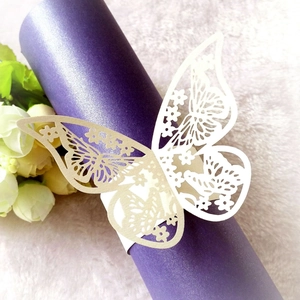 Laser-cut white butterfly paper napkin ring for elegant wedding and banquet table setting