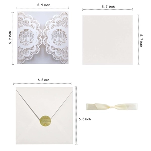 Laser cut white wedding invitation set with floral bird pattern and cream ribbon