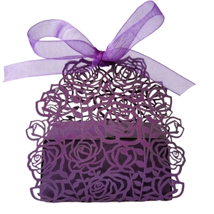 Purple hollow rose paper candy box with laser cut design and ribbon bow on white background