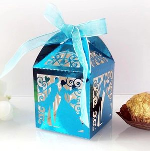 Close-up of laser-cut wedding candy box in bright blue with a glossy mirror finish