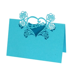 Detailed laser-cut bright blue table card featuring hollow rose heart and Love lettering