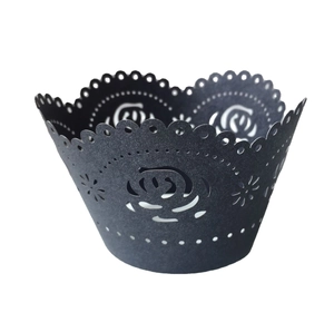 Elegant black laser cut paper cupcake wrappers featuring delicate rose floral patterns