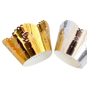 Laser cut cupcake wrappers in gold and silver with hollow heart and floral patterns
