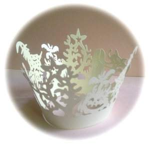 Detailed laser-cut ivory cupcake wrapper with Halloween pumpkin and bat motifs