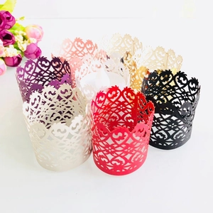 Laser cut hollow paper cupcake wrappers with heart floral patterns for wedding decor