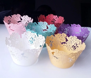 Laser-cut grape vine cupcake wrappers in various pearlized paper colors for party decor