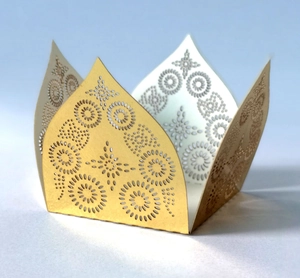 Detailed laser-cut gold wedding favor box featuring intricate radial floral hollow patterns