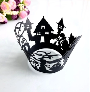 Laser-cut black Halloween cupcake wrappers featuring spooky castle and RIP tombstone detail