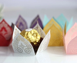 Laser cut hollow wedding candy paper wrappers in various colors for party favors
