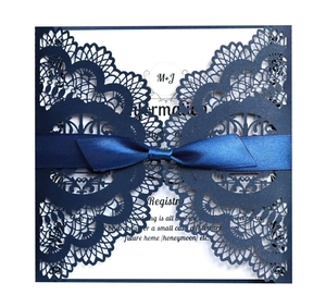 Laser cut navy blue wedding invitation with lace hollow pattern and satin ribbon bow