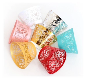 Laser-cut heart cupcake wrappers in multiple metallic colors for wedding decoration