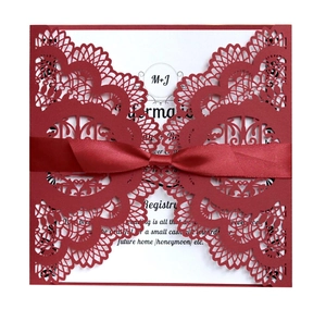 Red laser cut floral wedding invitation suite with silk ribbon and white insert card