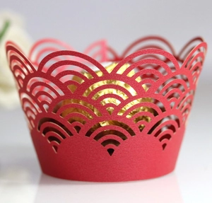 Intricate laser-cut red paper cupcake wrappers with auspicious cloud pattern for events