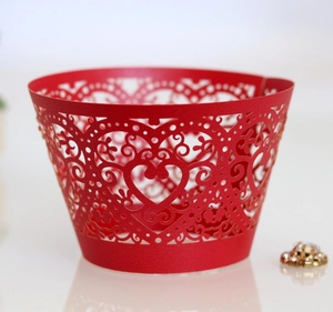 Laser cut red heart cupcake wrappers with elegant hollow patterns for wedding decor
