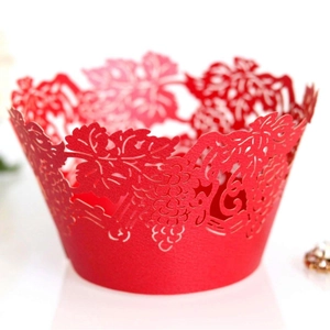 Laser cut red cupcake wrappers featuring elegant grape vines and leaf patterns