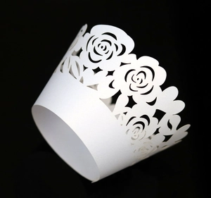 Elegant white laser-cut rose floral cupcake wrappers for wedding and party decorations