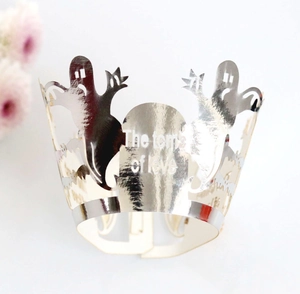 Detail of silver laser-cut cupcake wrapper featuring ghost and The Tomb of Love text