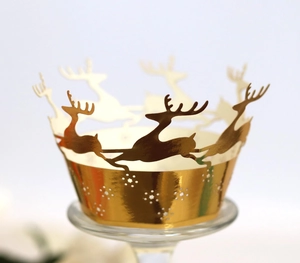 Detailed laser-cut golden reindeer cupcake wrapper with shiny metallic finish