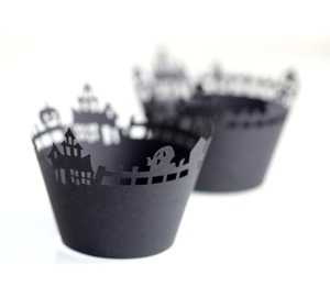 Laser-cut Halloween cupcake wrappers featuring spooky castle and ghost silhouettes