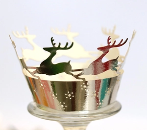 Detailed laser cut Christmas elk cake wrappers with mirror metallic silver finish