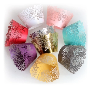 Assorted laser cut rose cupcake wrappers in multiple vibrant metallic colors