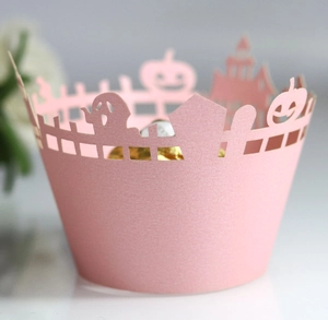 Laser-cut pink Halloween cupcake wrapper featuring hollow castle and pumpkin patterns