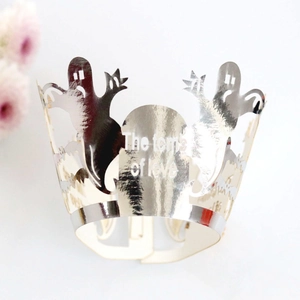 Silver laser-cut Halloween cupcake wrapper with ghost design and The Tomb of Love text