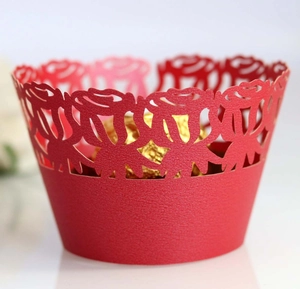 Detailed laser-cut rose pattern on red pearl paper cupcake wrapper for wedding decor