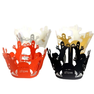 Laser cut Halloween cupcake wrappers featuring ghost and tombstone designs in multiple colors