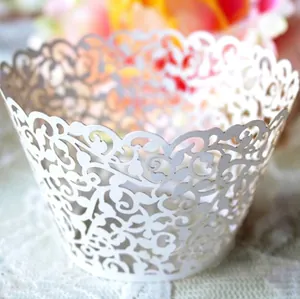 White laser-cut cupcake wrapper with vine hollow pattern for party cake decoration