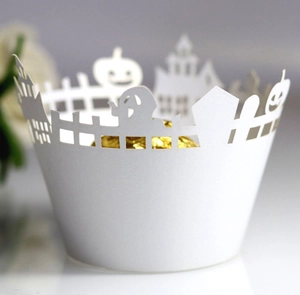 Laser-cut Halloween cupcake wrapper with white paper castle and pumpkin details